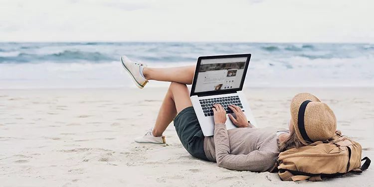 Virtual office at 155 North Wacker, Chicago, a man enjoys beach time, knowing he can respond to emails from anywhere.
