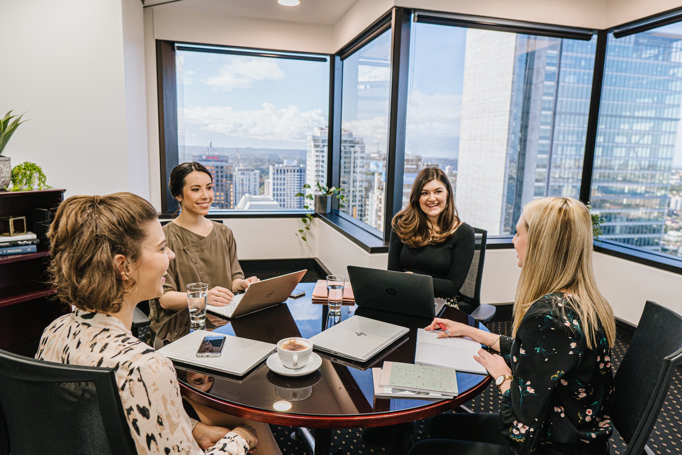 A team of professionals using a meeting room for collaboration.